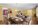 Open-concept living area, showcasing hardwood floors, dining area, and neutral paint scheme at 3712 Eaglebrook Dr, Gastonia, NC 28056