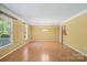Open living area with wood floors, natural light, and neutral walls ready for personalization at 3712 Eaglebrook Dr, Gastonia, NC 28056