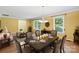 Bright living room showcasing ample natural light, hardwood floors, and a dining area at 3712 Eaglebrook Dr, Gastonia, NC 28056