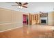 Large living room showcasing natural light, a brick fireplace, and custom built-in shelving at 3712 Eaglebrook Dr, Gastonia, NC 28056