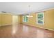 Bright living room featuring wood floors, sunny windows, and ample space for comfortable living and entertaining at 3712 Eaglebrook Dr, Gastonia, NC 28056