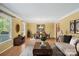 Inviting living room featuring a dining area, natural light, and hardwood floors at 3712 Eaglebrook Dr, Gastonia, NC 28056