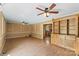 Spacious living room with ceiling fan, hardwood floors, and custom built-in shelving at 3712 Eaglebrook Dr, Gastonia, NC 28056