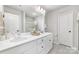 Bathroom boasts double sinks, quartz countertops, and modern fixtures at 4009 Stoneygreen Ln, Charlotte, NC 28215