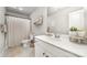 Well-lit bathroom features a white vanity, framed mirror, and stylish decorative elements at 4009 Stoneygreen Ln, Charlotte, NC 28215