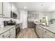 Well-equipped kitchen featuring modern appliances, sleek countertops, and ample cabinet space at 4009 Stoneygreen Ln, Charlotte, NC 28215