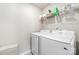 Practical laundry room features a modern washer and dryer, along with ample storage space at 4009 Stoneygreen Ln, Charlotte, NC 28215
