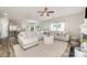 Open-concept living room boasts ample seating and views of the kitchen, great for entertaining at 4009 Stoneygreen Ln, Charlotte, NC 28215
