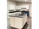 Modern kitchen features white cabinets, black countertops, and stainless steel appliances at 420 Baker Street Ext, Rock Hill, SC 29730