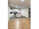 Open-concept living and kitchen area featuring an island and stainless steel appliances at 420 Baker Street Ext, Rock Hill, SC 29730