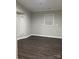 Cozy living room with a large window providing natural light, durable flooring at 420 Baker Street Ext, Rock Hill, SC 29730