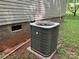 Exterior shot of the air conditioning unit on a concrete pad, next to the house at 4225 Stewart Rd, Claremont, NC 28610