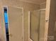 This guest bath features a tiled stand-up shower, linen closet, and modern fixtures at 4225 Stewart Rd, Claremont, NC 28610