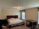 A bedroom with neutral walls, carpet floors, and a window providing natural light at 4225 Stewart Rd, Claremont, NC 28610