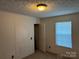 Bedroom with neutral carpet, light walls, a window with blinds, and a closet at 4225 Stewart Rd, Claremont, NC 28610