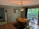 Enjoy this quaint dining room with deck access, perfect for entertaining! at 4225 Stewart Rd, Claremont, NC 28610