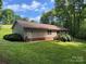 Home exterior featuring siding, deck, and well maintained yard at 4225 Stewart Rd, Claremont, NC 28610