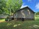 Exterior of home featuring a deck, siding, and a yard with mature trees at 4225 Stewart Rd, Claremont, NC 28610