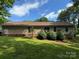 Exterior of the home featuring a deck and mature landscaping at 4225 Stewart Rd, Claremont, NC 28610