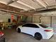 The garage features an unfinished interior with a concrete floor, with a white car parked inside at 4225 Stewart Rd, Claremont, NC 28610