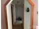 Hallway with neutral carpet, light walls, and wooden-trimmed entryways at 4225 Stewart Rd, Claremont, NC 28610