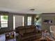 A cozy living room with neutral tones, carpet flooring, comfortable seating and views to the exterior at 4225 Stewart Rd, Claremont, NC 28610