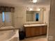 This full bath has double sinks, a walk-in tiled shower, and a large vanity at 4225 Stewart Rd, Claremont, NC 28610