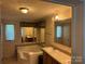 An oversized tub, ample lighting, and large mirrors provide a luxurious feel in this main bathroom at 4225 Stewart Rd, Claremont, NC 28610