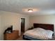 This main bedroom features a wooden accent wall and ensuite access at 4225 Stewart Rd, Claremont, NC 28610