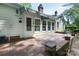 Lovely brick patio with awning is perfect for outdoor enjoyment at 4234 Woodglen Ln, Charlotte, NC 28226