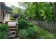 Picturesque backyard with lush greenery, a picket fence, and a tranquil garden at 4234 Woodglen Ln, Charlotte, NC 28226