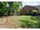 This home has a spacious yard with mature shade trees at 4234 Woodglen Ln, Charlotte, NC 28226