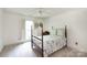 Bedroom with neutral carpet, window with wooden blinds and a quaint wooden bed frame at 4234 Woodglen Ln, Charlotte, NC 28226