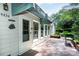 Charming home exterior featuring a brick patio, awning, and well-maintained landscaping at 4234 Woodglen Ln, Charlotte, NC 28226