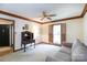 Cozy living room featuring natural light, neutral carpet, and ceiling fan at 4234 Woodglen Ln, Charlotte, NC 28226