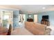 Open-concept living room featuring light blue walls that leads to the foyer, promoting seamless flow at 4234 Woodglen Ln, Charlotte, NC 28226