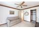 Living room features crown molding, a comfortable couch and built in shelves at 4234 Woodglen Ln, Charlotte, NC 28226