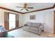 Living room features crown molding, a window with wooden blinds and a comfortable couch at 4234 Woodglen Ln, Charlotte, NC 28226