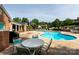 Relaxing community pool area with lounge chairs, tables, and a well-maintained pool at 4234 Woodglen Ln, Charlotte, NC 28226