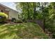 There is a spacious, well-maintained yard with mature trees at 4234 Woodglen Ln, Charlotte, NC 28226