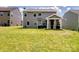 Spacious backyard featuring a screened patio and well-maintained lawn at 4316 Falls Lake Sw Dr, Concord, NC 28025