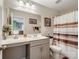 Clean bathroom with a white vanity, large mirror, and a shower with a curtain rod at 4316 Falls Lake Sw Dr, Concord, NC 28025
