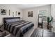 Relax in this bedroom with a queen size bed, mirror, and plenty of natural light at 4316 Falls Lake Sw Dr, Concord, NC 28025