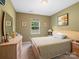 Neutral bedroom with carpeted floors, a window, and a dresser at 4316 Falls Lake Sw Dr, Concord, NC 28025