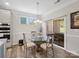 Cozy dining area with a glass table and backyard view through sliding glass doors at 4316 Falls Lake Sw Dr, Concord, NC 28025