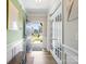 Inviting foyer with wood floors, neutral paint, and French doors to an office at 4316 Falls Lake Sw Dr, Concord, NC 28025
