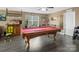 Game room with pool table, bar, and hardwood floors at 4316 Falls Lake Sw Dr, Concord, NC 28025