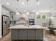 Modern kitchen features granite countertops, stainless steel appliances, and a large center island at 4316 Falls Lake Sw Dr, Concord, NC 28025
