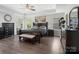 Spacious main bedroom with tray ceilings, lots of natural light, and wood floors at 4316 Falls Lake Sw Dr, Concord, NC 28025