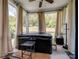 Relax in the sun room with a hot tub and windows looking out to the trees at 4316 Falls Lake Sw Dr, Concord, NC 28025